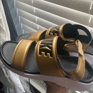 gold and black strapped mike sandals